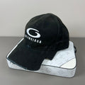 Black distressed cotton cap with contrast emblem and graffiti underbrim